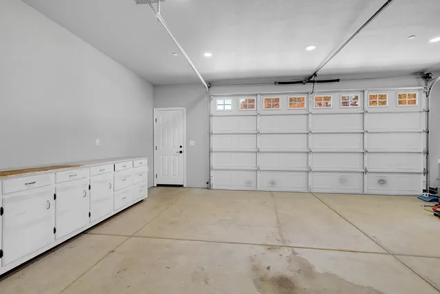 a view of a backyard with a white house