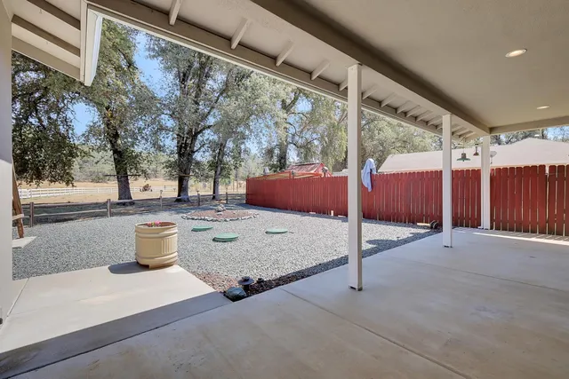 a kitchen with refrigerator and microwave
