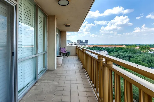 a view of a balcony with wooden floor