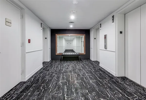 a bathroom with a shower sink vanity and mirror