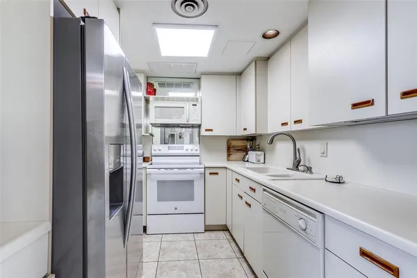 a view of a swimming pool with outdoor seating and plants