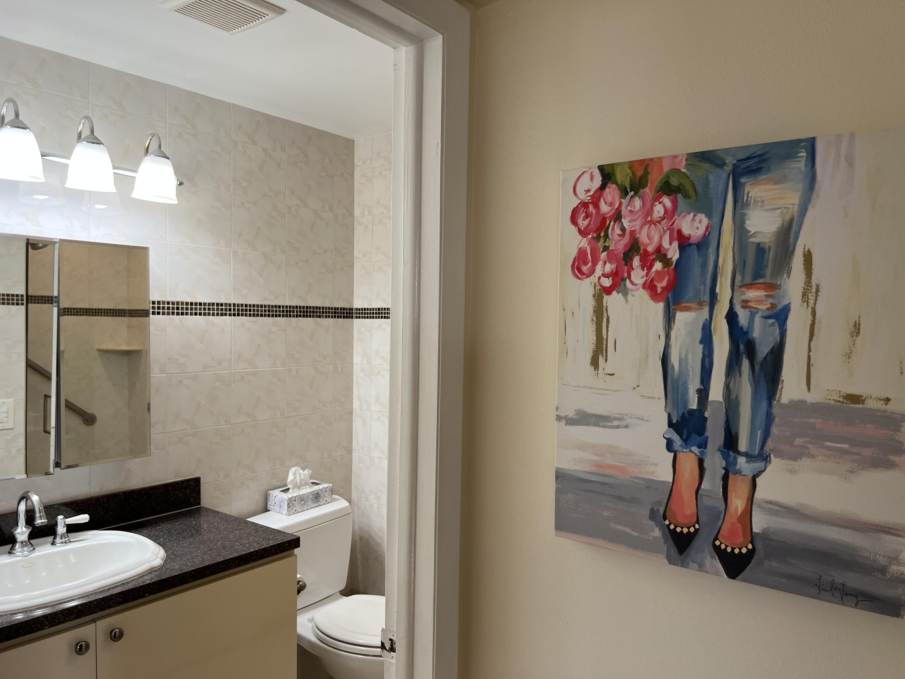 183 Normandy Lane Delray Beach, FL 33484 - Photo 14 of 80 a bathroom with a sink vanity mirror and toilet