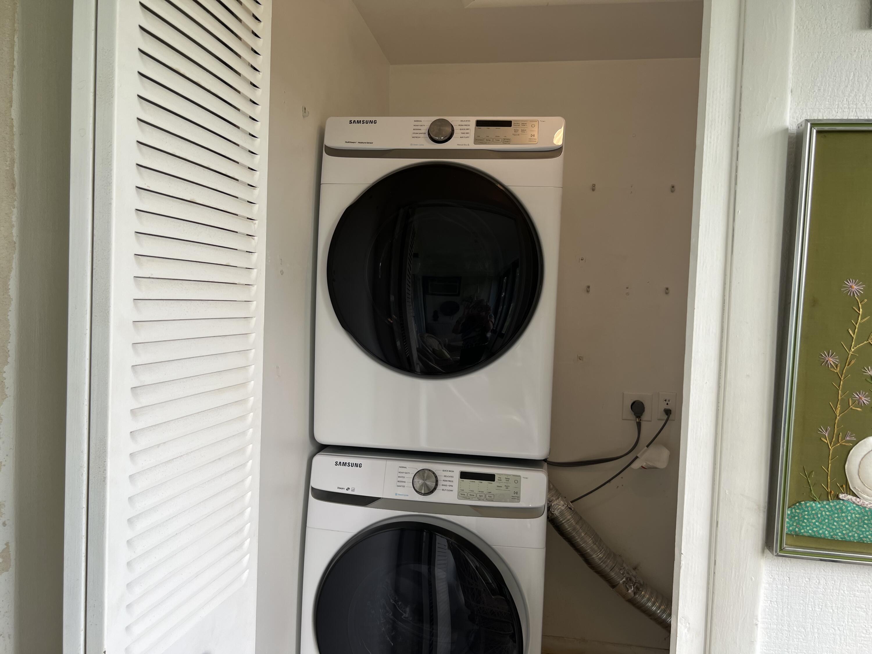 183 Normandy Lane Delray Beach, FL 33484 - Photo 23 of 80 a close up view of a washer and dryer