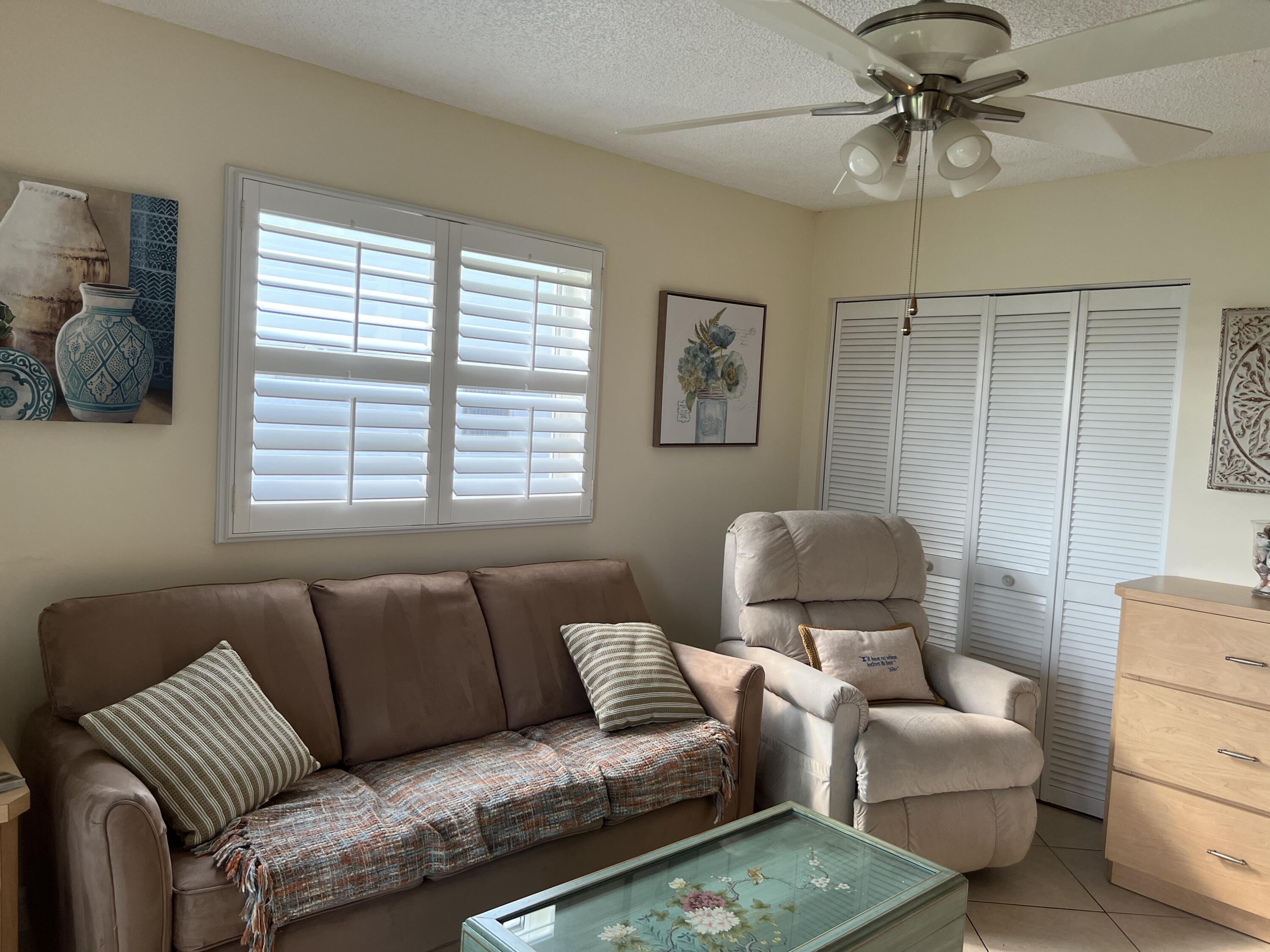 183 Normandy Lane Delray Beach, FL 33484 - Photo 24 of 80 a living room with furniture and a window