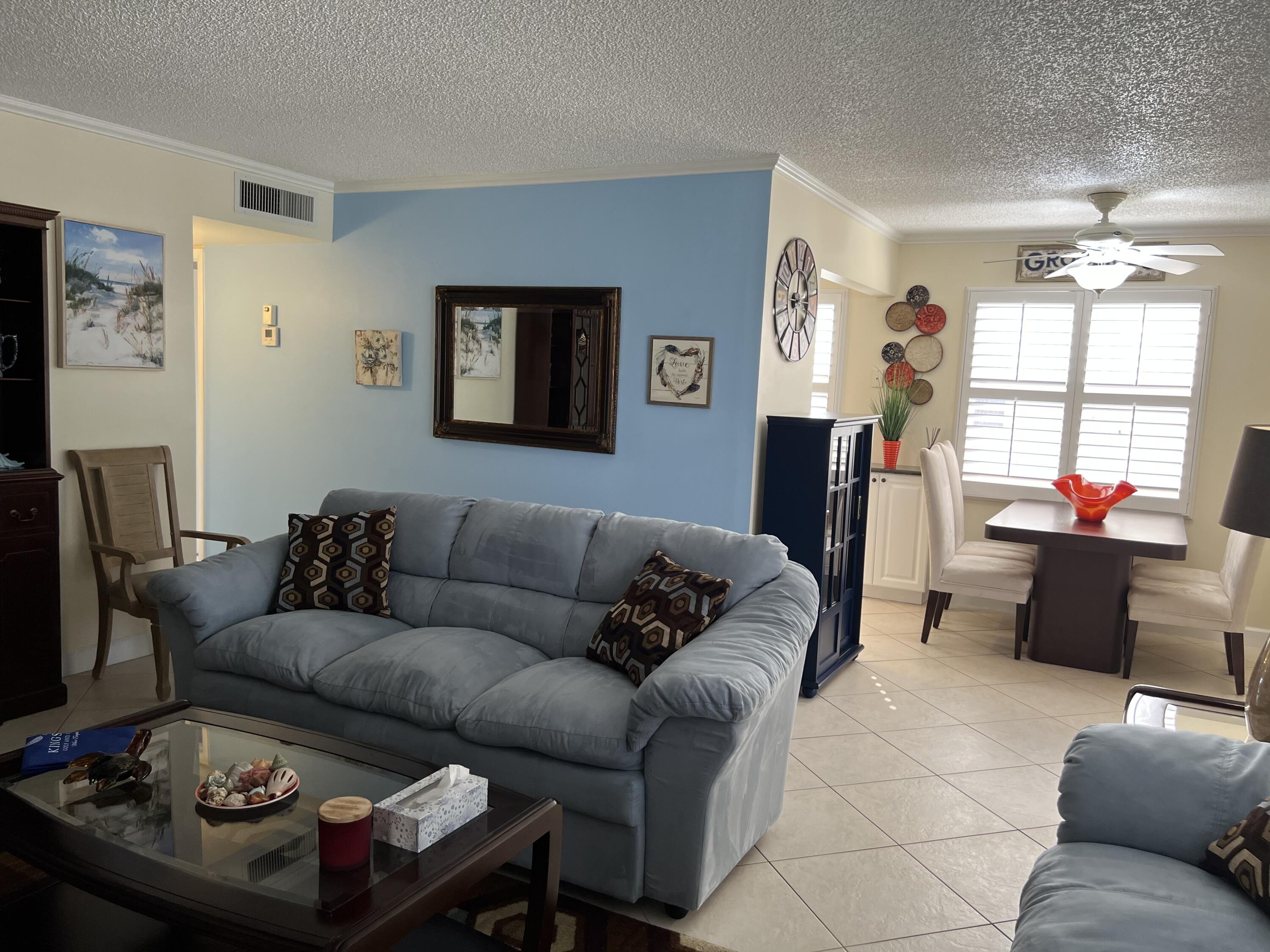 183 Normandy Lane Delray Beach, FL 33484 - Photo 28 of 80 a living room with furniture and a flat screen tv