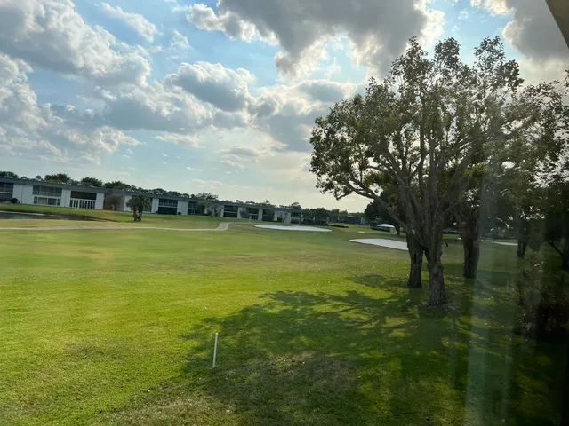 a view of a golf course with a lake