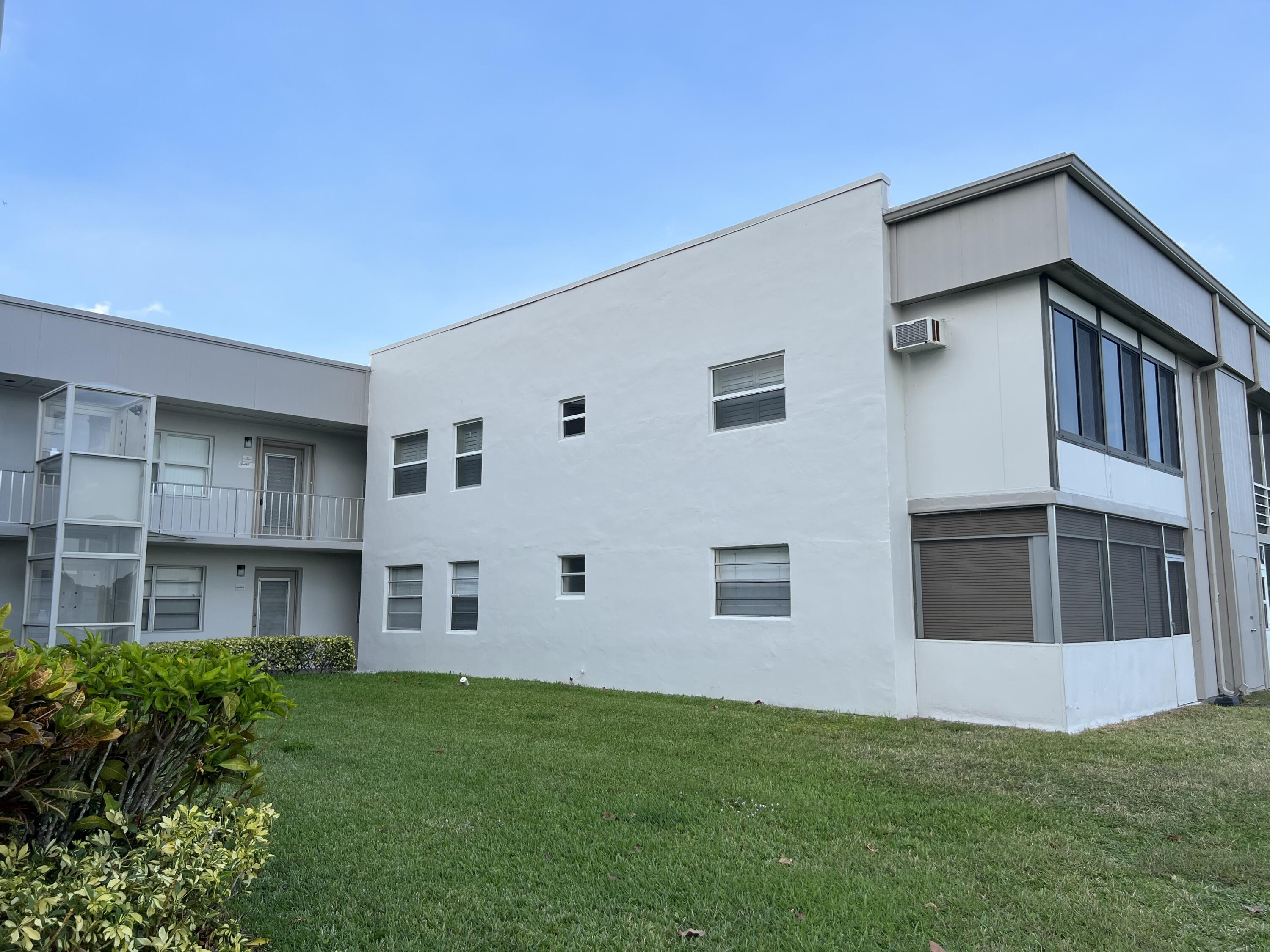 183 Normandy Lane Delray Beach, FL 33484 - Photo 53 of 80 a house view with a garden space