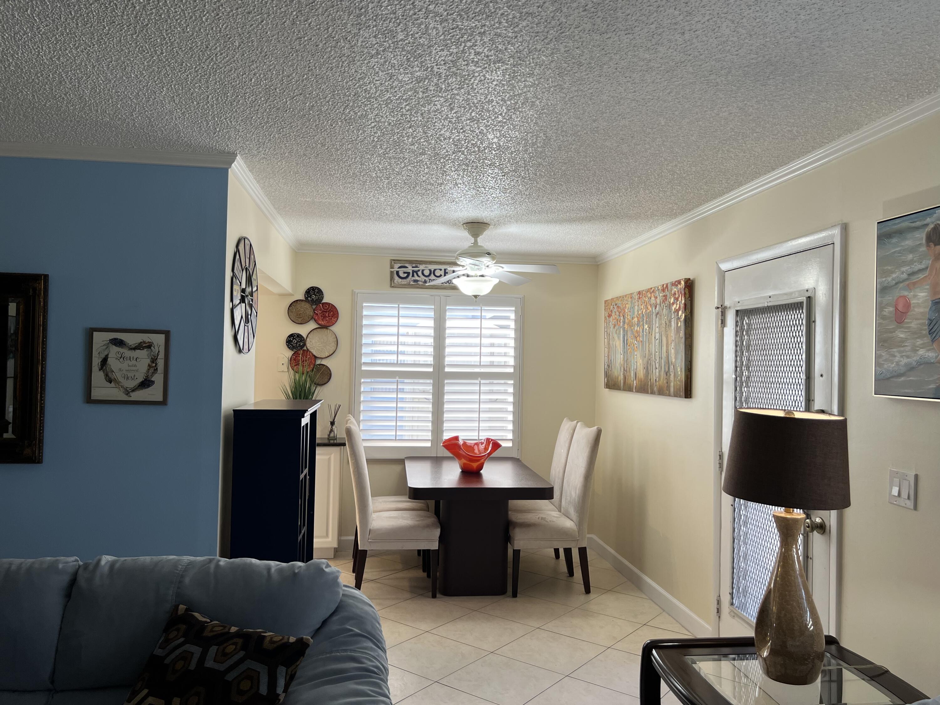 183 Normandy Lane Delray Beach, FL 33484 - Photo 6 of 80 a living room with furniture and a window