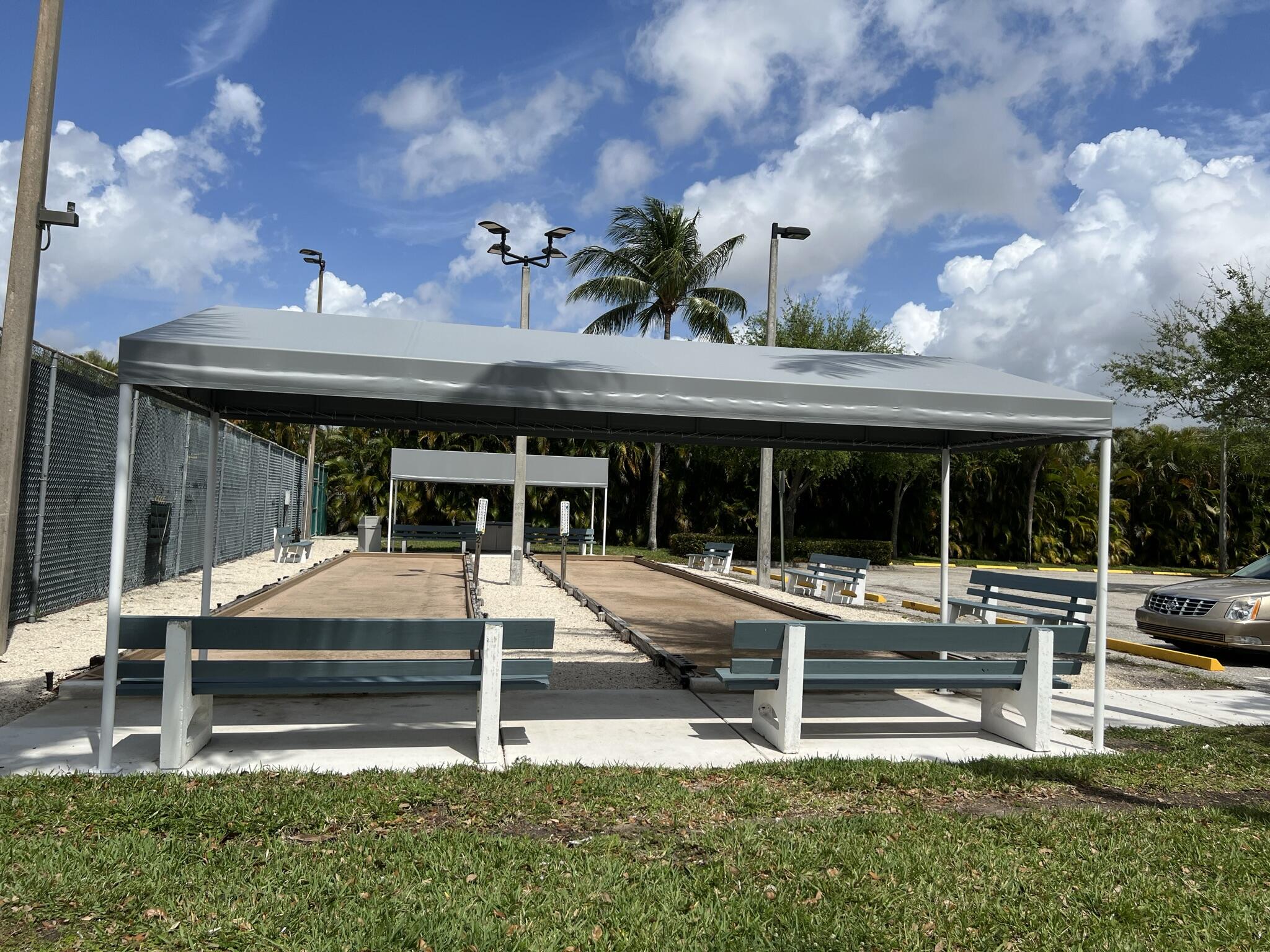 183 Normandy Lane Delray Beach, FL 33484 - Photo 77 of 80 a house view with a sitting space