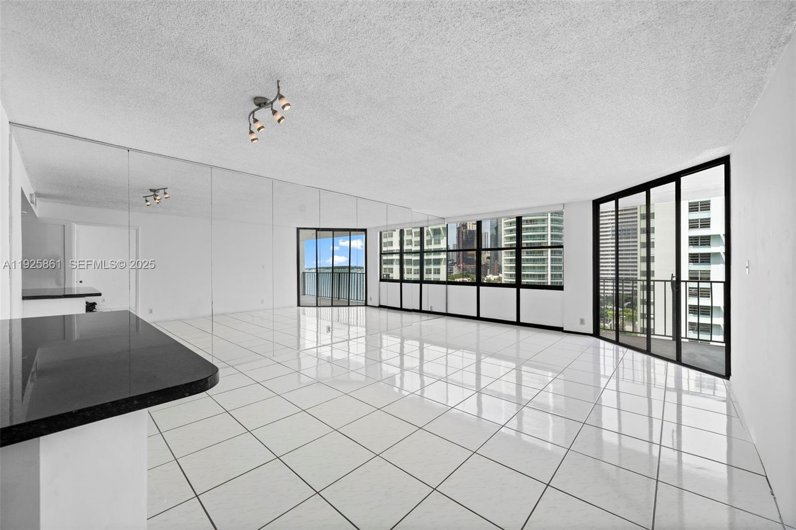 1865 Brickell Avenue, Unit A1102 Miami, FL 33129 - Photo 1 of 4 a view of an empty room with window