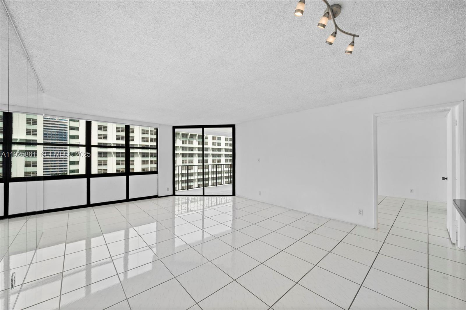 1865 Brickell Avenue, Unit A1102 Miami, FL 33129 - Photo 2 of 4 a view of an empty room with a window