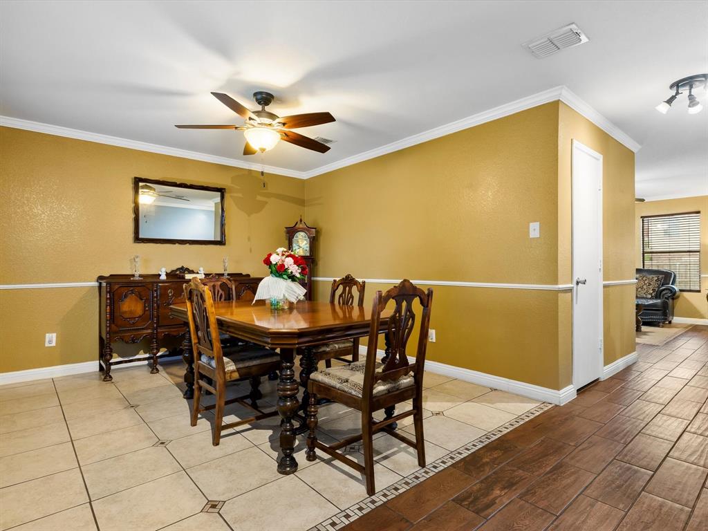 1129 Switchgrass Lane Crowley, TX 76036 - Photo 5 of 40 a view of a dining room with furniture and a chandelier