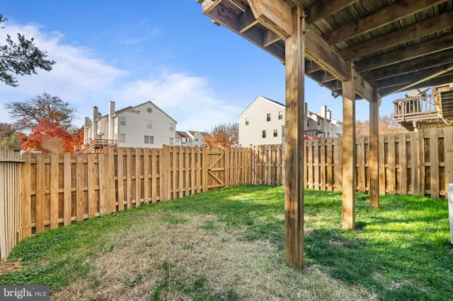 a view of a house with backyard and porch