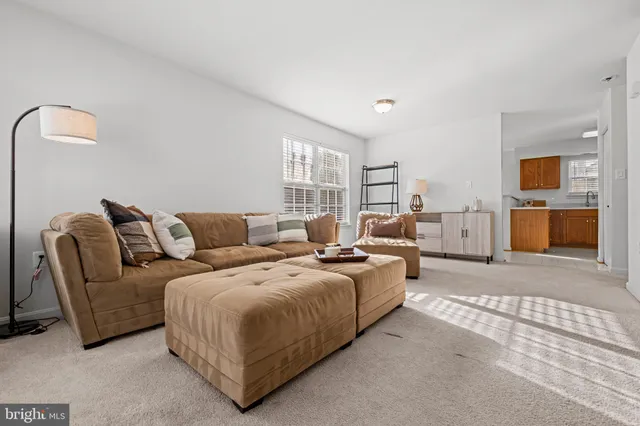 a spacious bedroom with a bed and couch