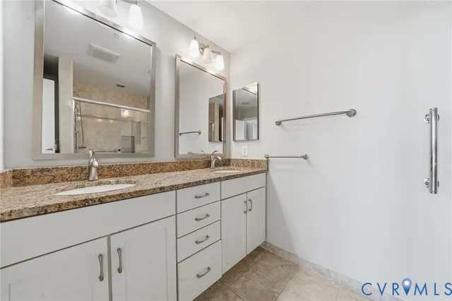 a bathroom with a glass shower door