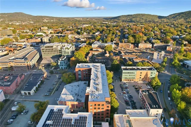 an aerial view of a residential houses with outdoor space