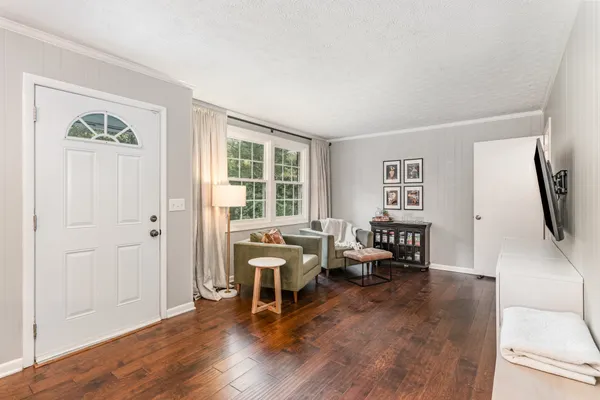 a living room with furniture and a flat screen tv