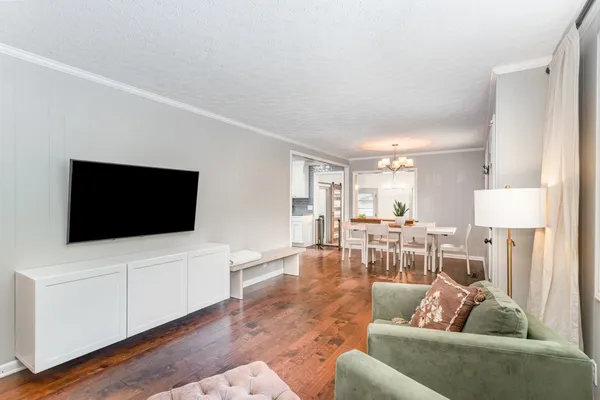 a living room with furniture and a flat screen tv