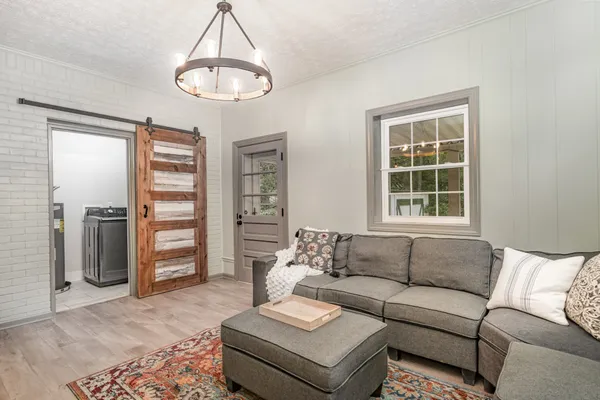 a living room with furniture and a window