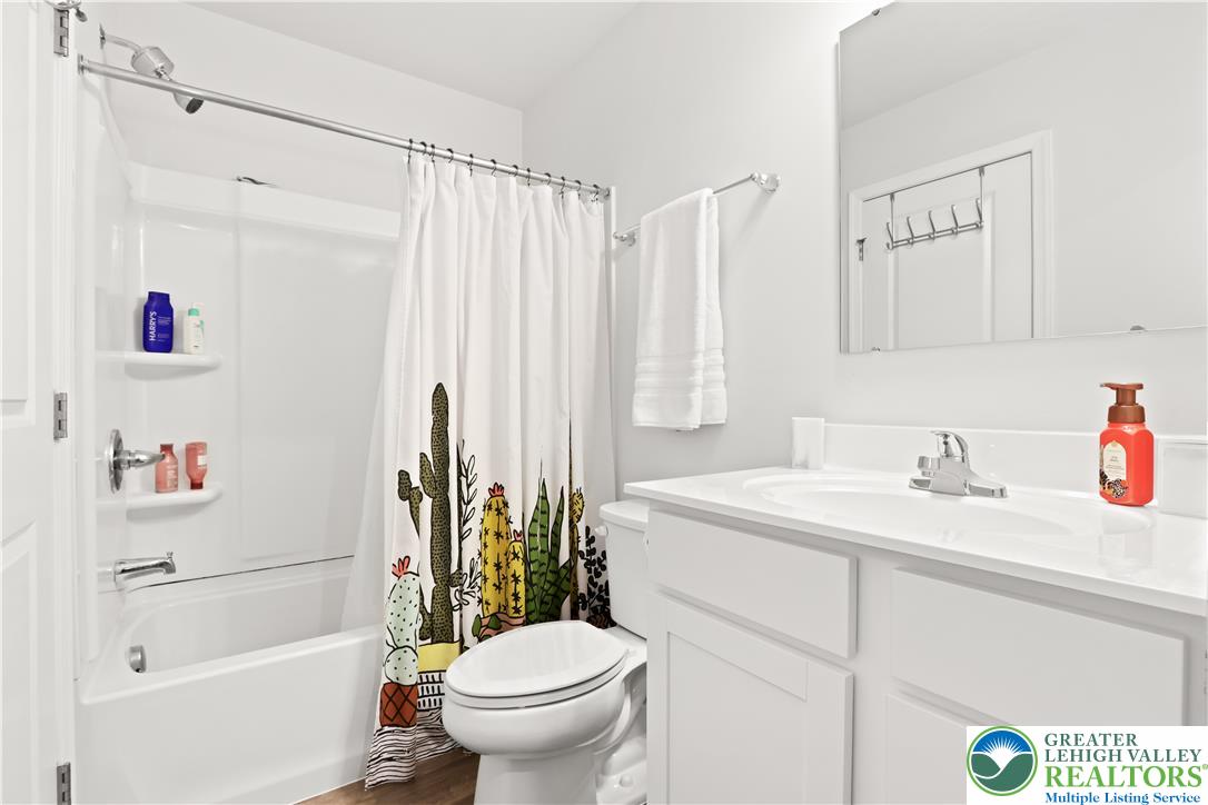 2336 Alex Road Easton, PA 18040 - Photo 18 of 35 A well-lit bathroom features a white vanity, modern fixtures, and a clean tub-shower combo.