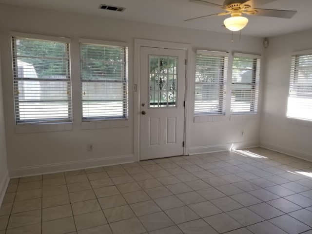 1210 Dearing Road Memphis, TN 38117 - Photo 14 of 25 Take your pick on how to use this spacious room - it's perfect for an office, sunroom, playroom or exercise room! Entry from this room leads to the fenced back yard!