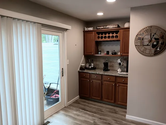 a kitchen with stainless steel appliances granite countertop a refrigerator and a stove