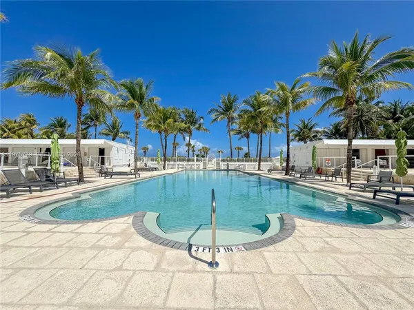 a view of a swimming pool with a sitting space