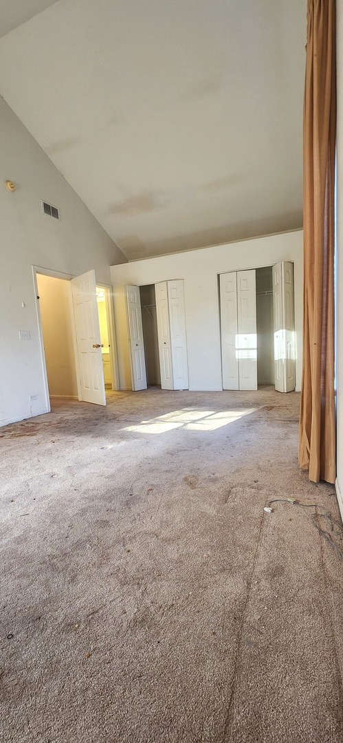117 Enclave Circle, Unit A Bolingbrook, IL 60440 - Photo 13 of 18 a view of an empty room with window