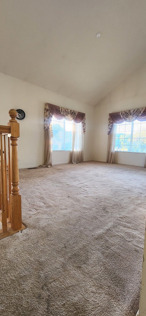117 Enclave Circle, Unit A Bolingbrook, IL 60440 - Photo 6 of 18 a view of a room with gym equipment and a fireplace