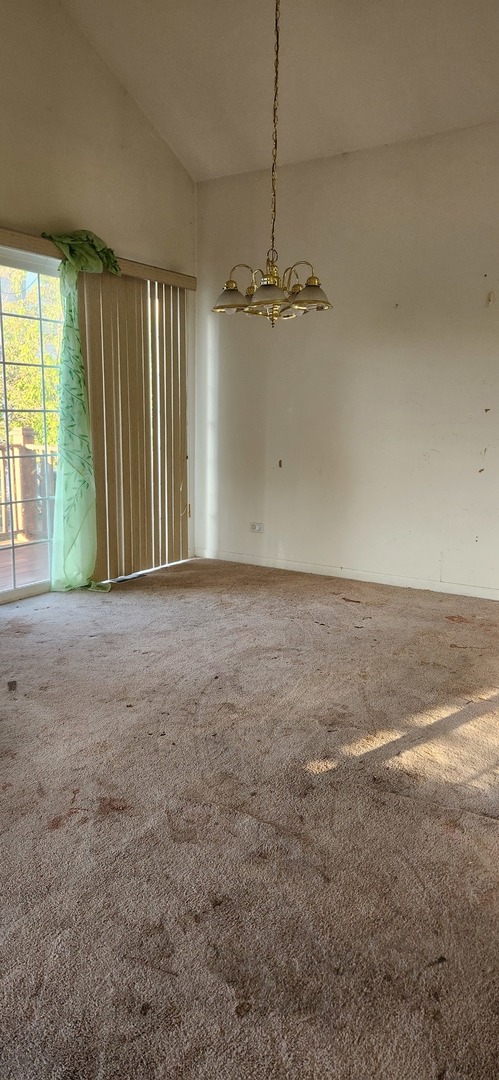 117 Enclave Circle, Unit A Bolingbrook, IL 60440 - Photo 7 of 18 a view of an empty room with a window