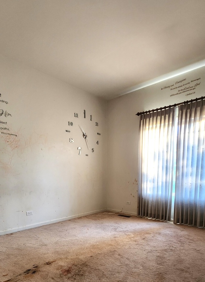 117 Enclave Circle, Unit A Bolingbrook, IL 60440 - Photo 10 of 18 an empty room with a window