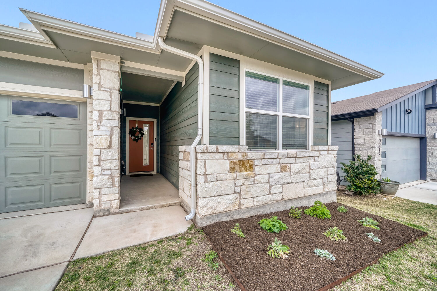 2308 Ranier Court Austin, TX 78754 - Photo 1 of 29 Beautiful home on a quiet street featuring stone siding and an attached garage