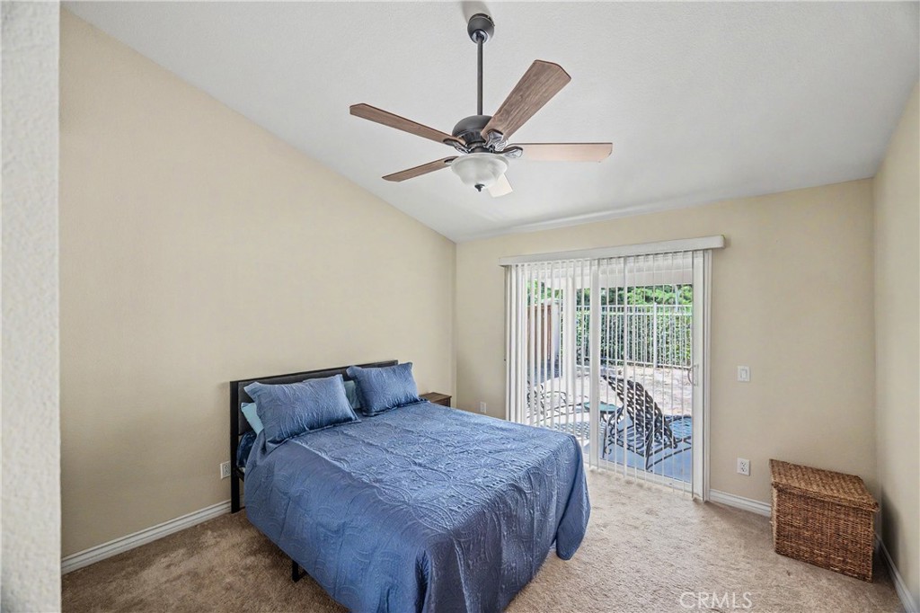 43121 Corte Cabrera Temecula, CA 92592 - Photo 9 of 17 a bedroom with a bed and a ceiling fan