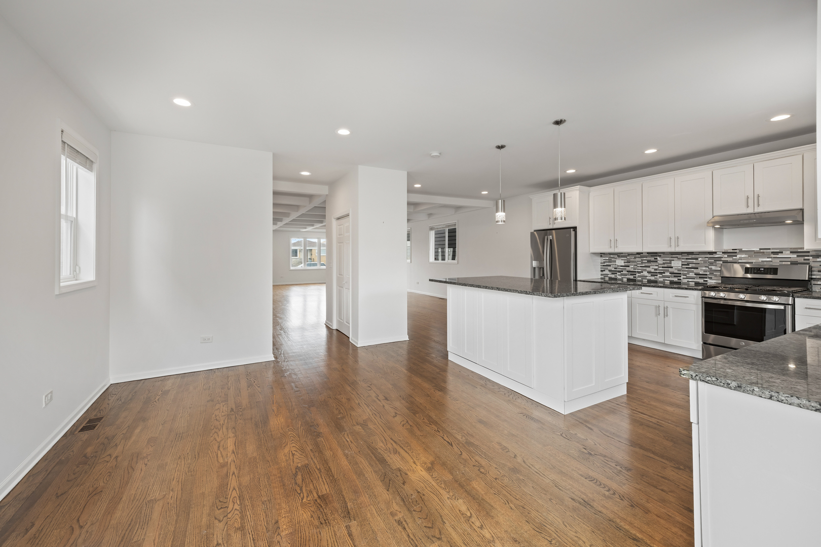 1823 35th Avenue Stone Park, IL 60165 - Photo 16 of 44 a view of kitchen with wooden floor and windows