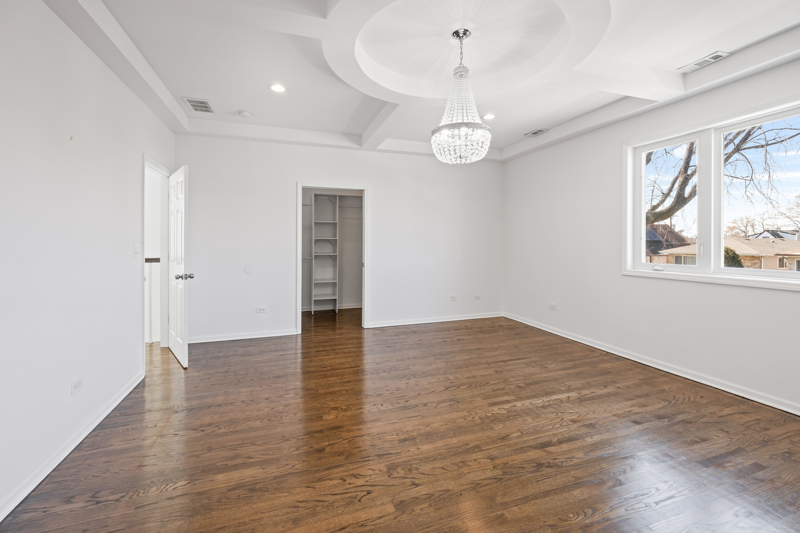 1823 35th Avenue Stone Park, IL 60165 - Photo 20 of 44 an empty room with wooden floor and windows