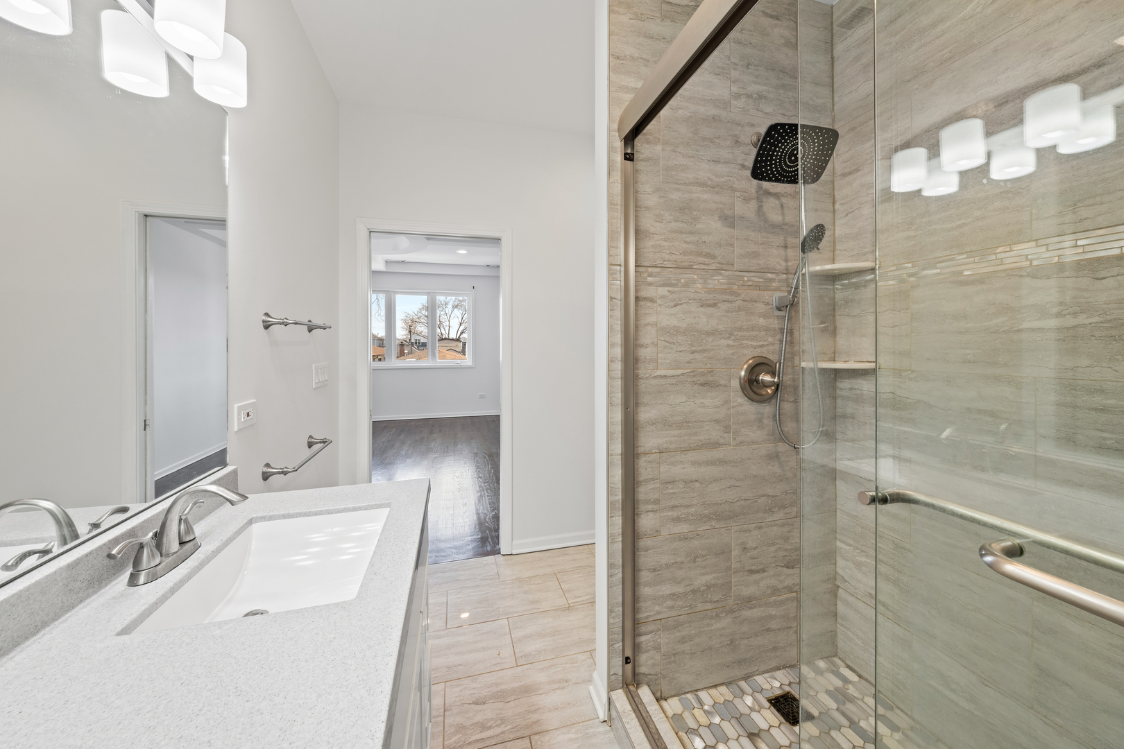 1823 35th Avenue Stone Park, IL 60165 - Photo 23 of 44 a bathroom with a sink a toilet and shower