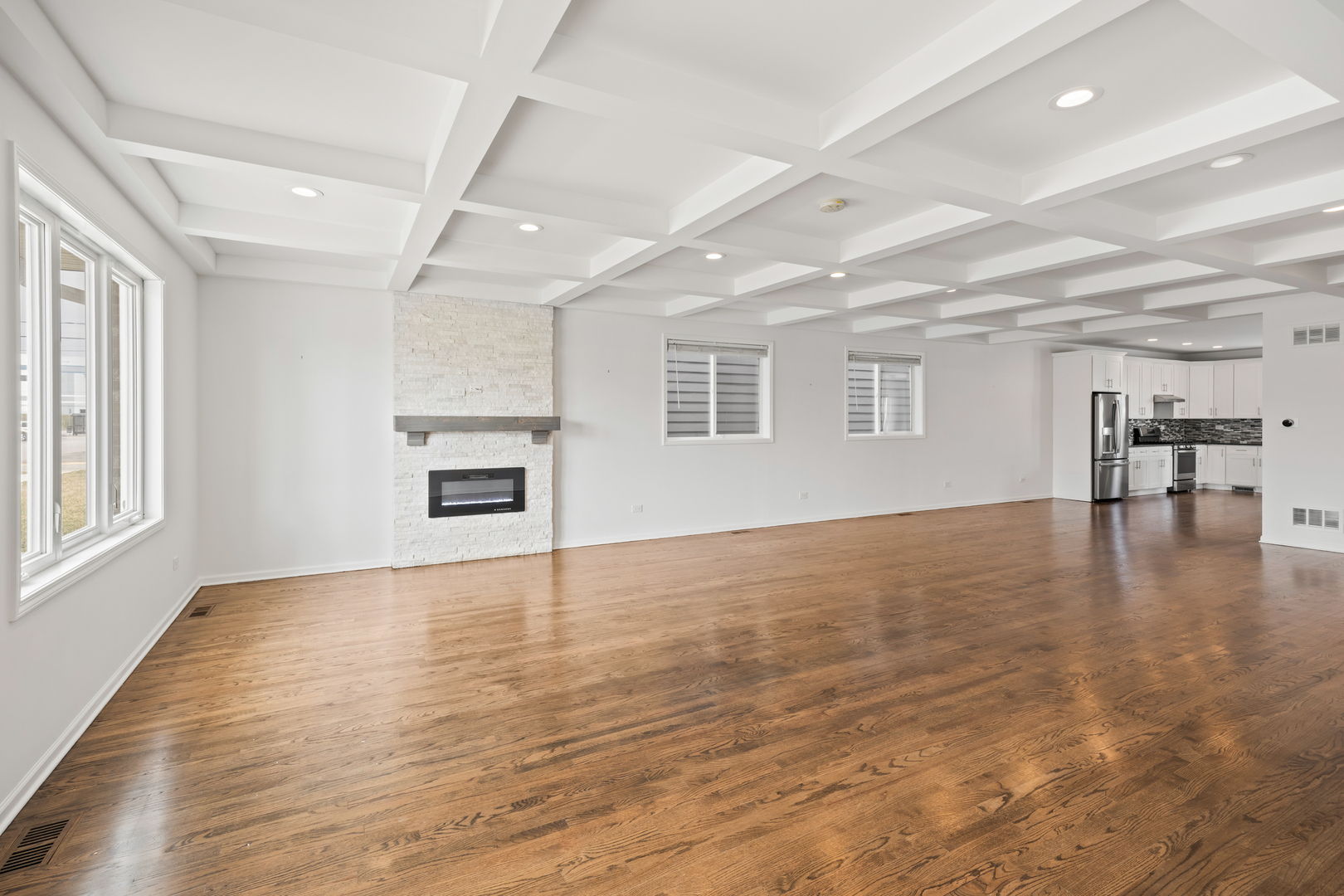 1823 35th Avenue Stone Park, IL 60165 - Photo 5 of 44 an empty room with wooden floor and windows