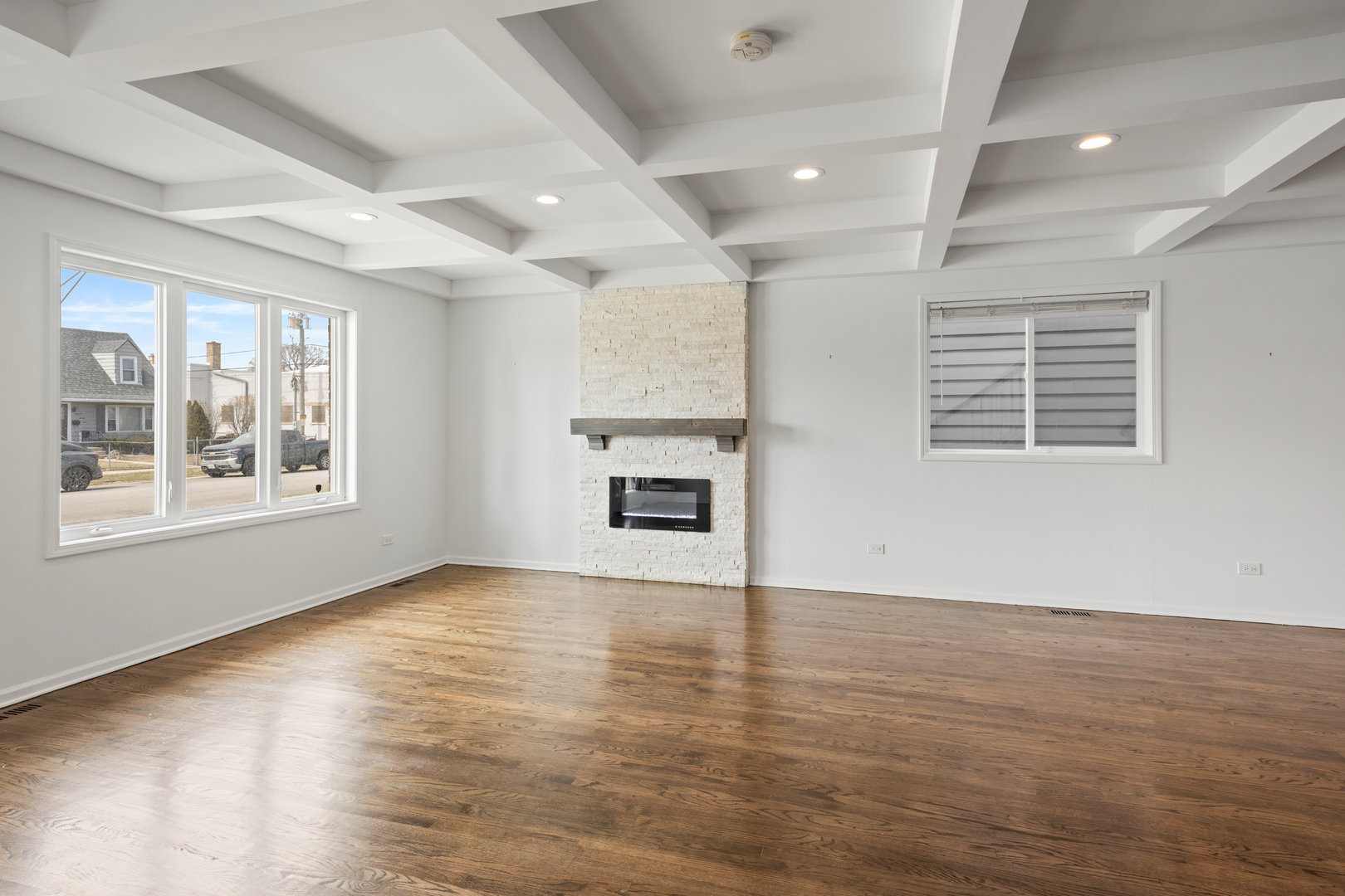 1823 35th Avenue Stone Park, IL 60165 - Photo 6 of 44 an empty room with wooden floor and windows