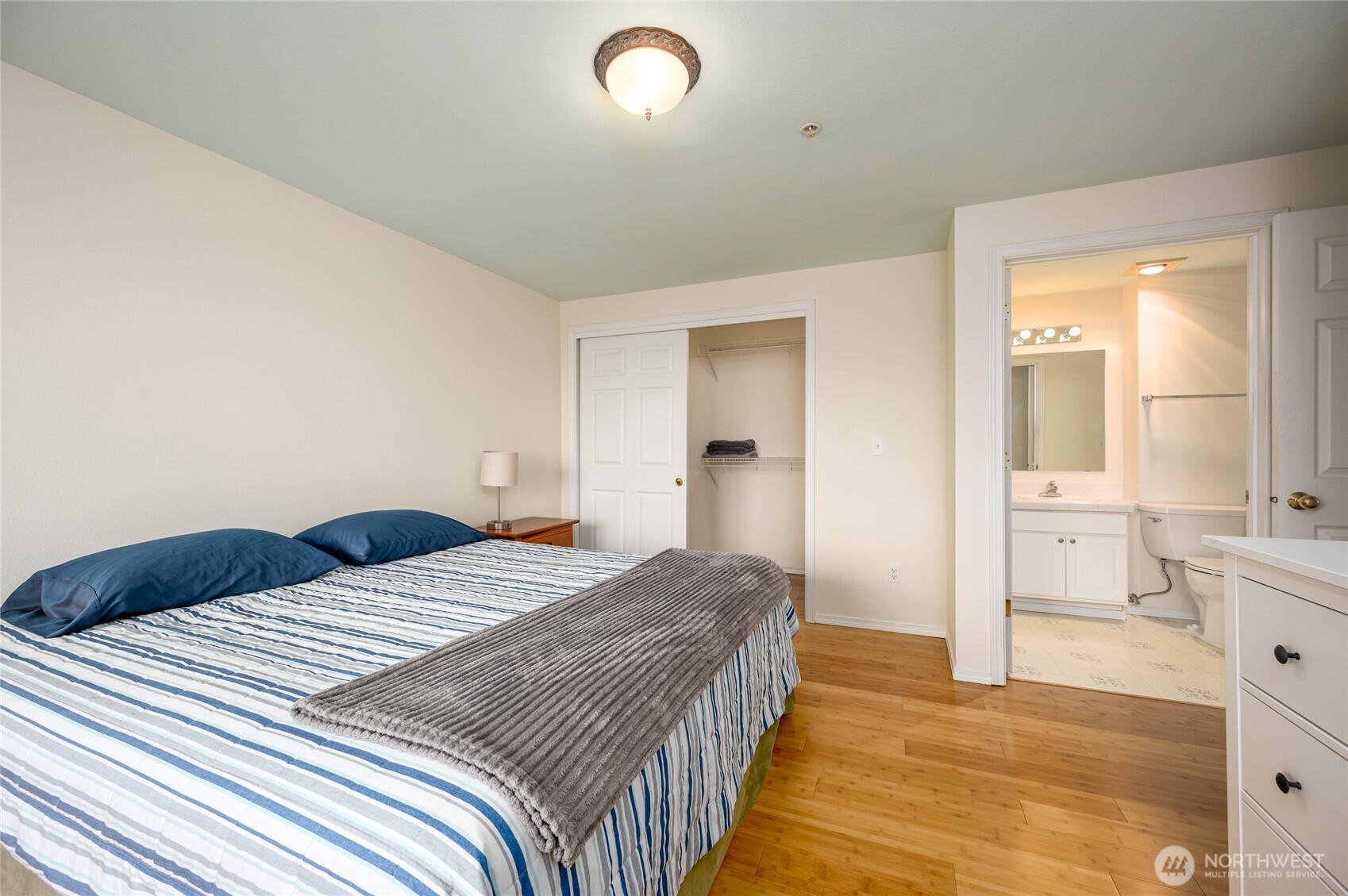 910 34th Street, Unit 202 Anacortes, WA 98221 - Photo 11 of 20 a bedroom with a bed and a view of bathroom