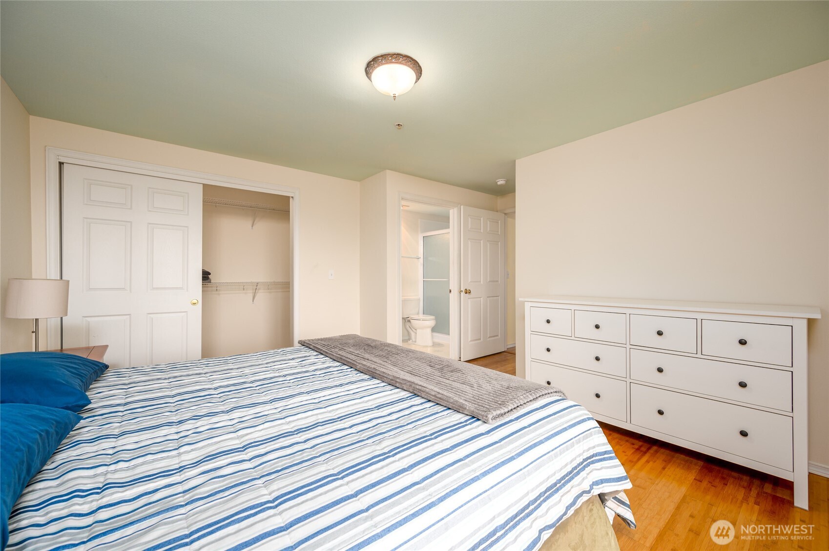 910 34th Street, Unit 202 Anacortes, WA 98221 - Photo 12 of 20 a bedroom with a bed and closet