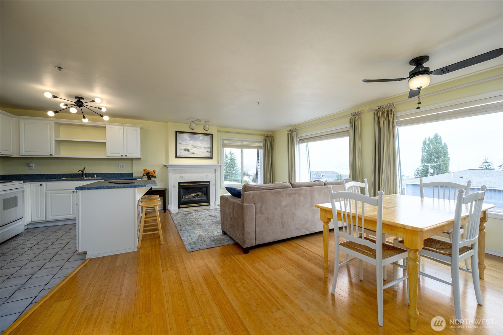 910 34th Street, Unit 202 Anacortes, WA 98221 - Photo 3 of 20 a living room with fireplace furniture and a wooden floor
