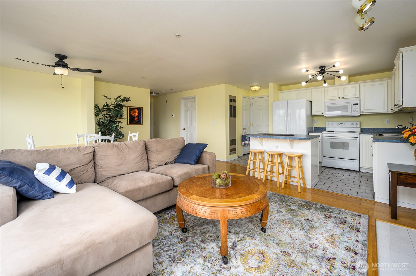 910 34th Street, Unit 202 Anacortes, WA 98221 - Photo 4 of 20 a living room with furniture and a dining table