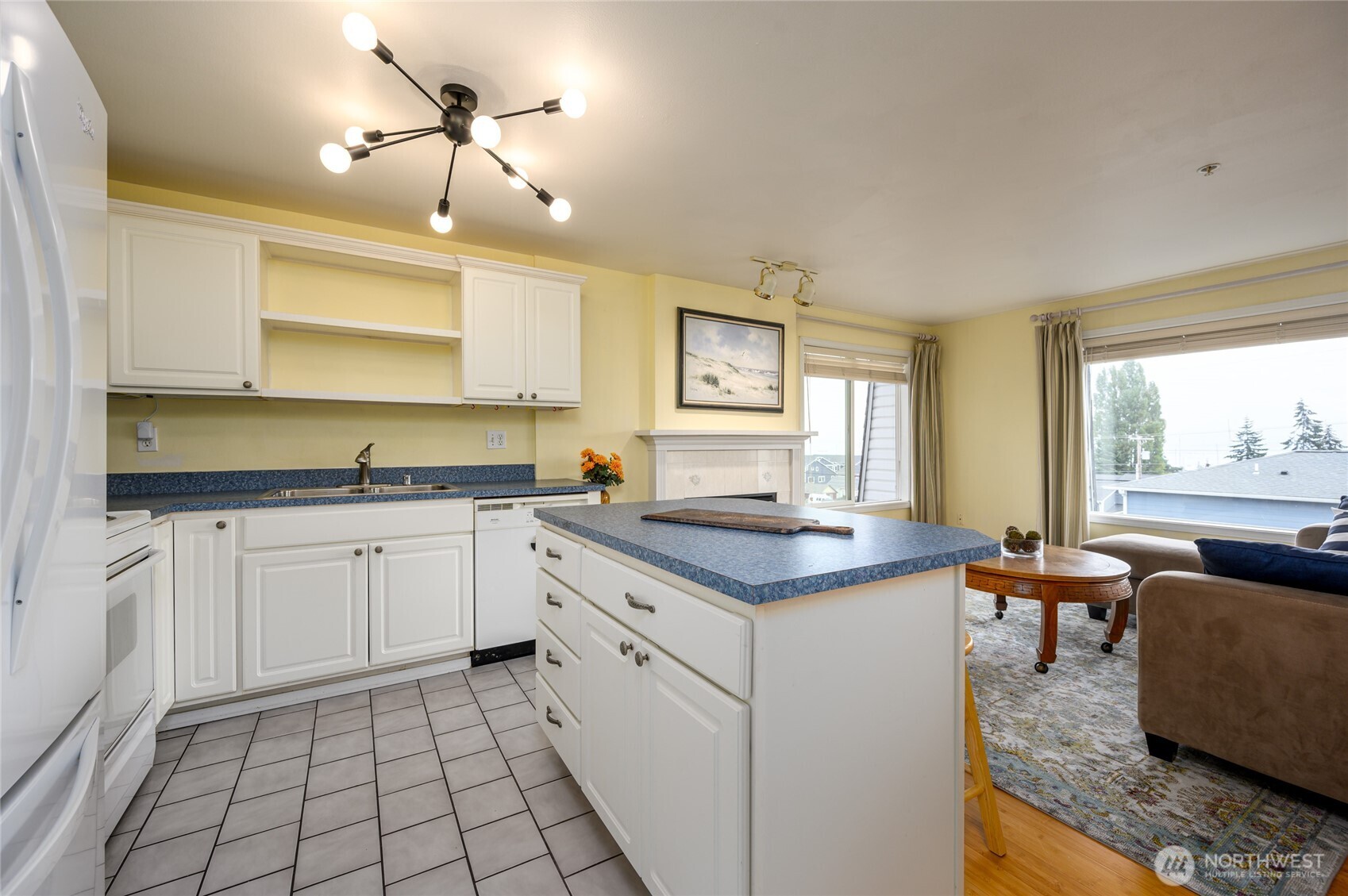 910 34th Street, Unit 202 Anacortes, WA 98221 - Photo 7 of 20 a kitchen with stainless steel appliances granite countertop a sink and a stove