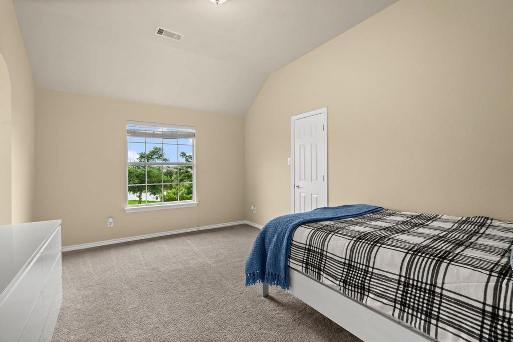 2703 Pottery Trail Corinth, TX 76210 - Photo 25 of 40 a bedroom with a bed and a window