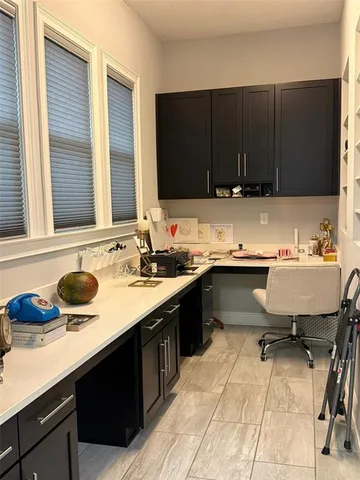 a kitchen with a sink and a stove top oven