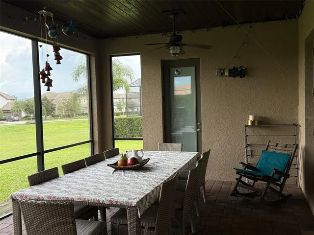 a view of a dining room with furniture window and outside view