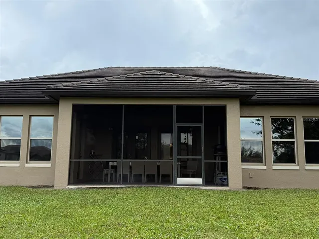 a view of front door and yard