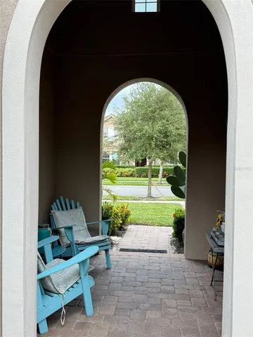 a view of a room with a porch and furniture
