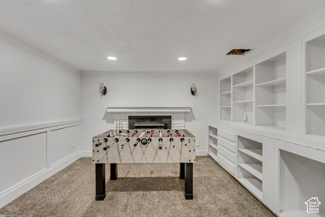 360 East Center Street Centerville, UT 84014 - Photo 37 of 41 Rec room with light colored carpet, recessed lighting, crown molding, a decorative wall, and a wainscoted wall
