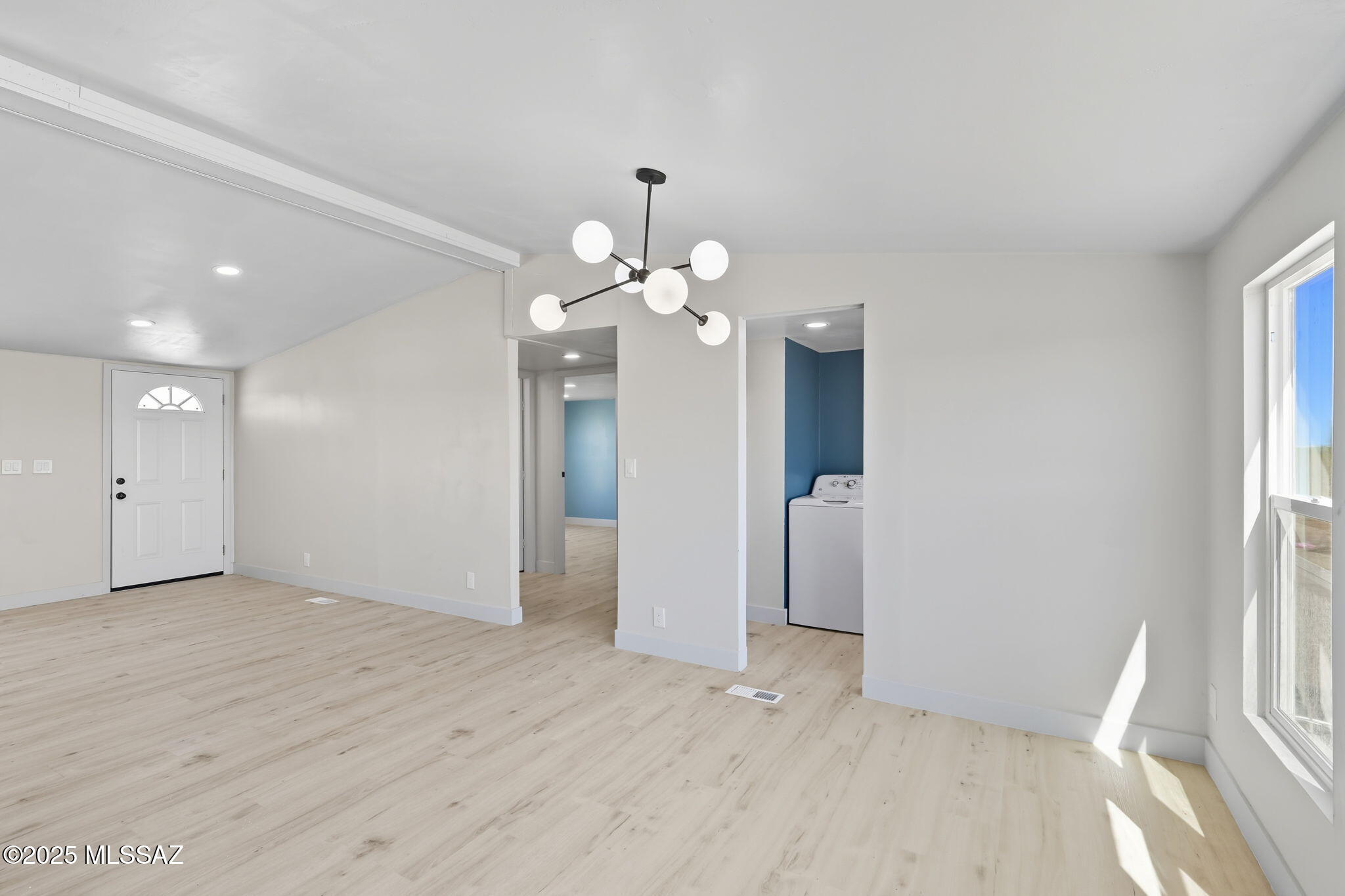 8790 North Trico Road Marana, AZ 85653 - Photo 11 of 35 wooden floor in an empty room with a window